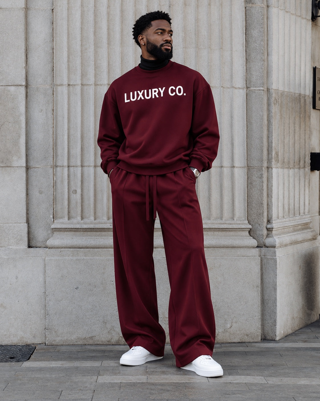 Luxury Co. black crewneck and wide-leg lounge pants on male model